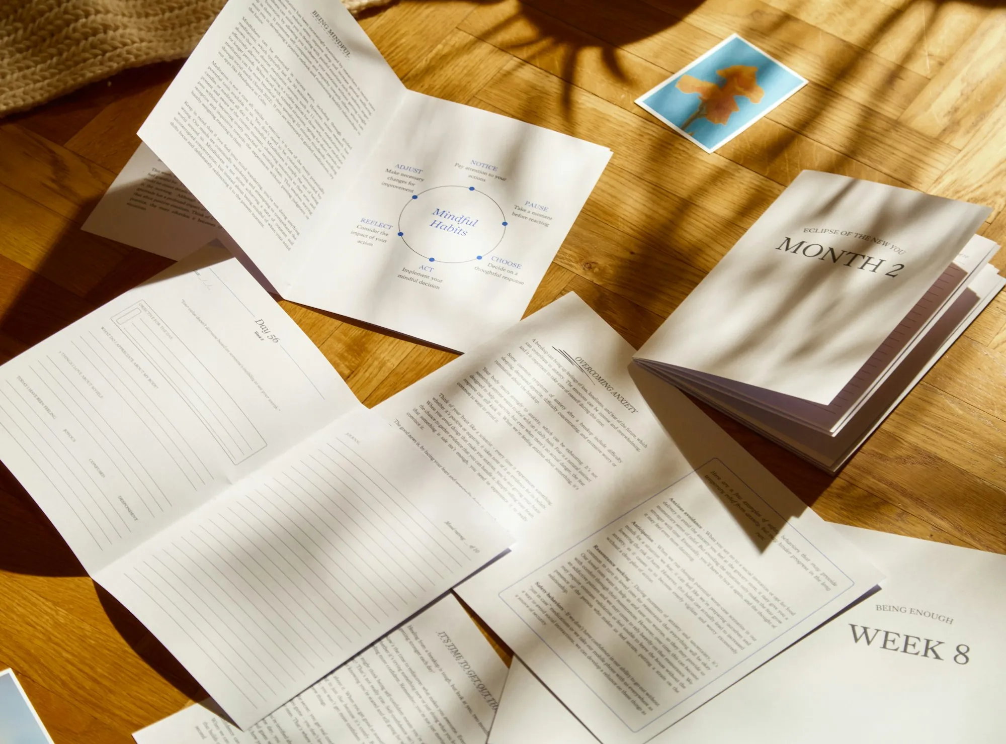 Papers spread across a wooden table